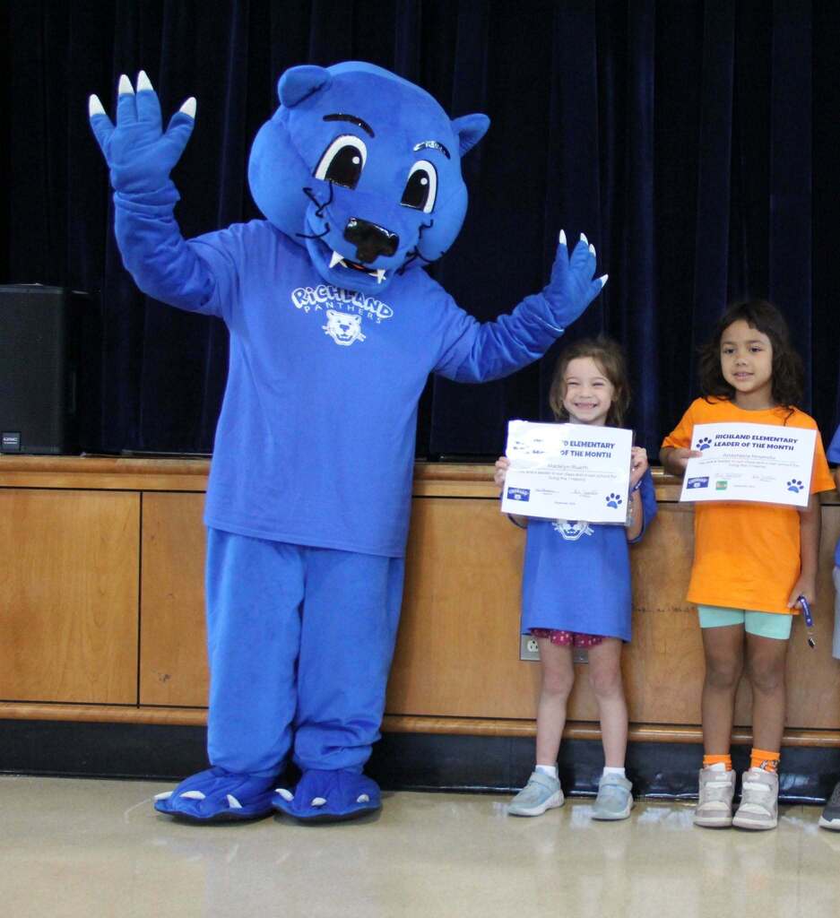 Student Leaders smile with their Leadership Certificates with Richie the Panther Mascot