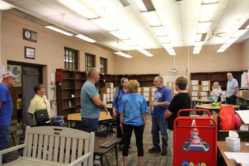 Community members explore the library of QE