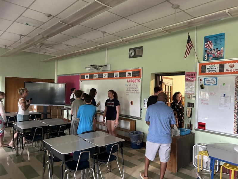 Community members walk the halls of QE