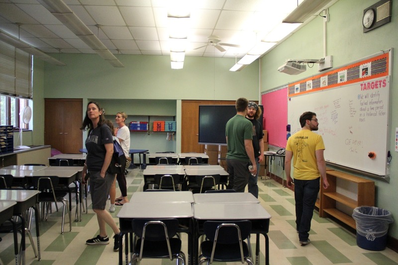 Community members walk the halls of QE