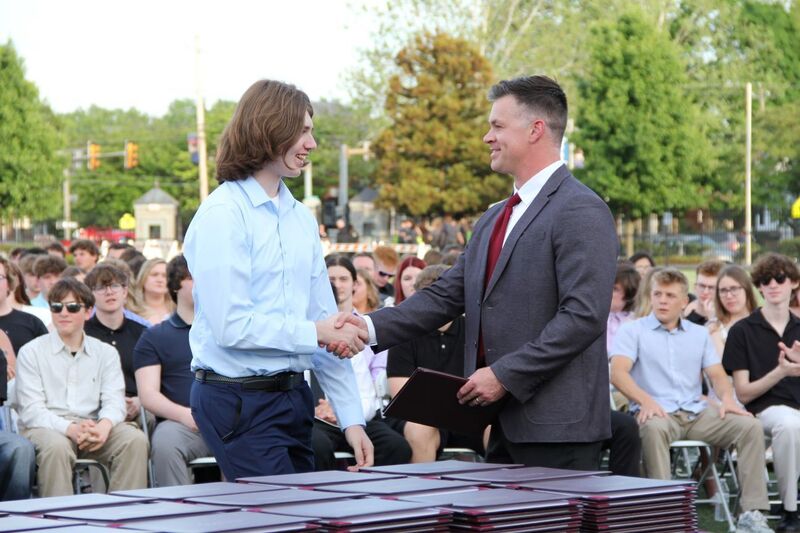 Shaking hands with graduates