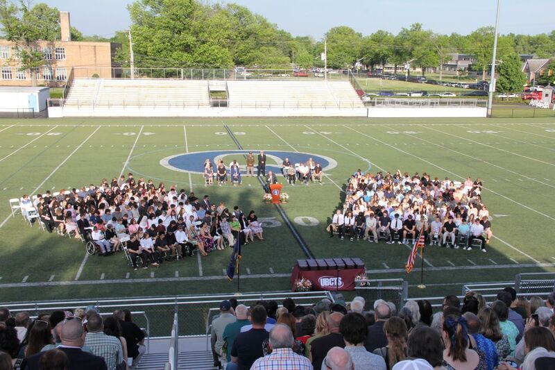 Graduates on alumni field
