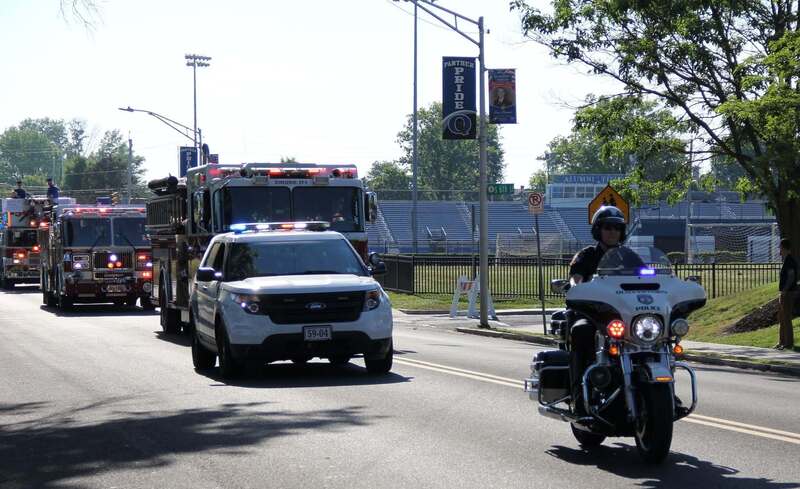 The police and fire motorcade start the parade