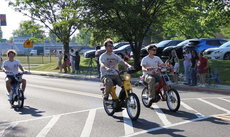Students driving motorcylcles