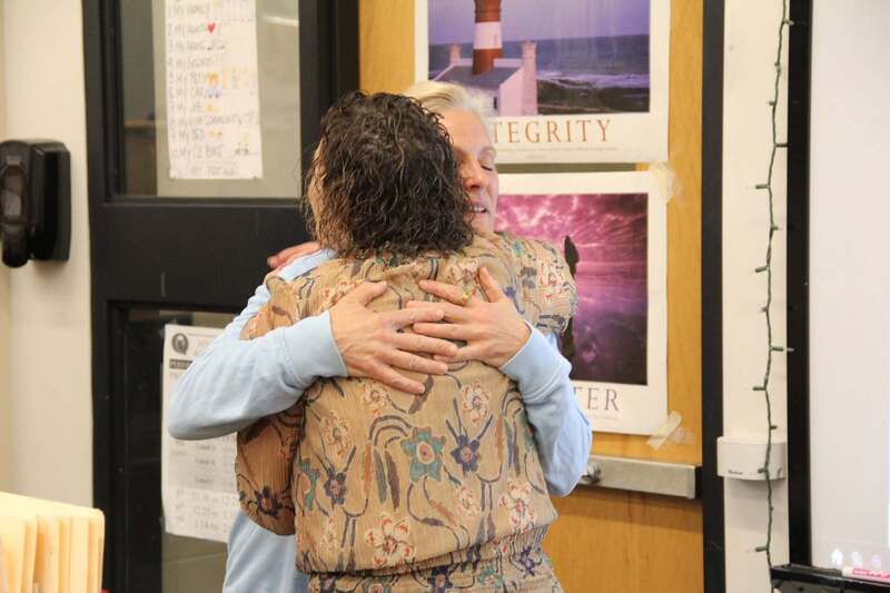 Dr. Hoffman hugs Mrs. Bratina