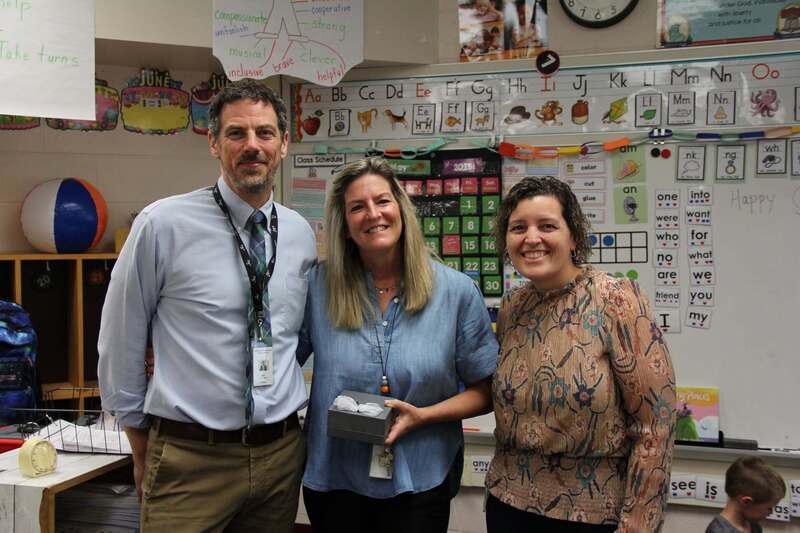 Dr. Schmucker and Dr. Hoffman smile with Mrs. Deiley