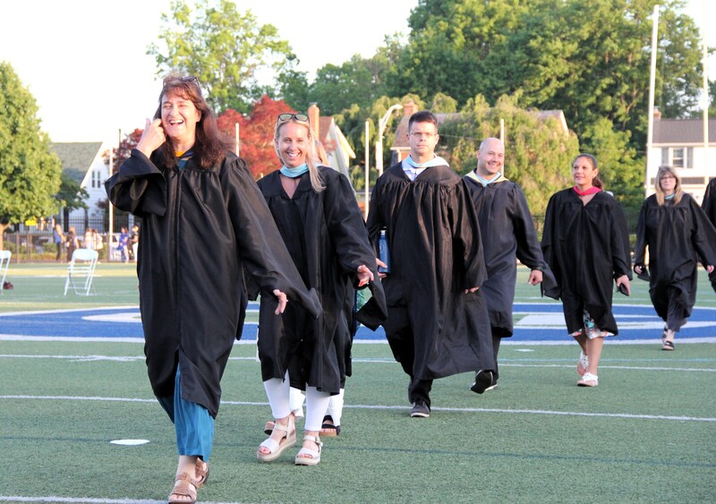 Teachers enter Alumni Field 