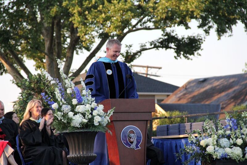 Dr. van’t Hoenderdaal  welcomes the crowd at the podium