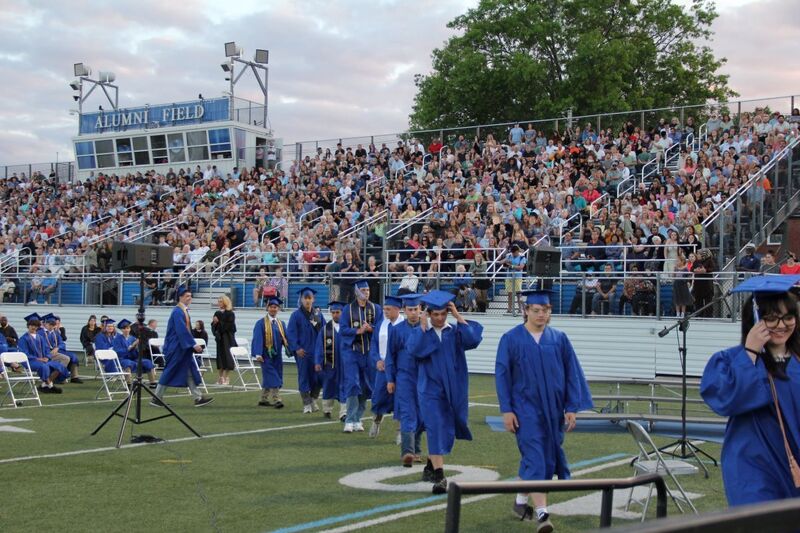 Students ascend the stage