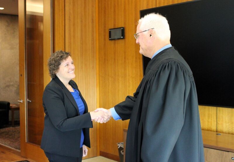 Dr. Hoffman shaking hands with Judge Weintraub