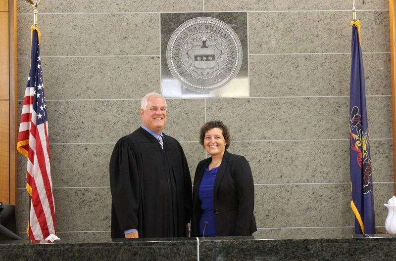 Dr. Hoffman and Judge Weintraub smile for a photo