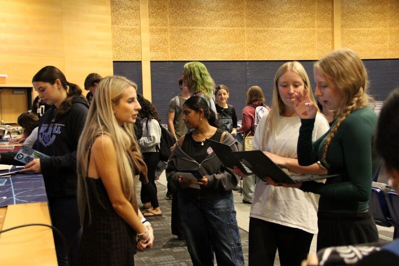 Students chat with representatives and ask questions