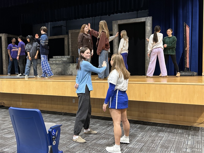 Students perform a "stage slap"