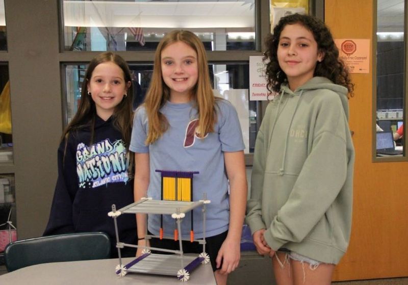 Recycled Paper Maker Team: Kennedy, Paisley, and Addison / The Power Girls pose for a photo with their invention