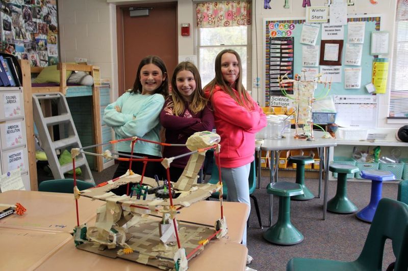 Team "The Scrapsavers" pose with their invention