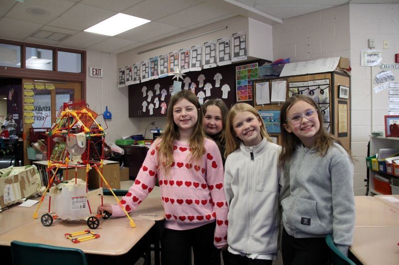 Team "The Earthquake Finders" pose with their invention