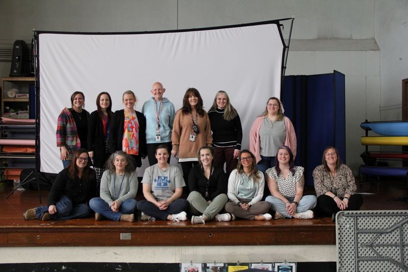 QE Paraprofessionals take a group photo.