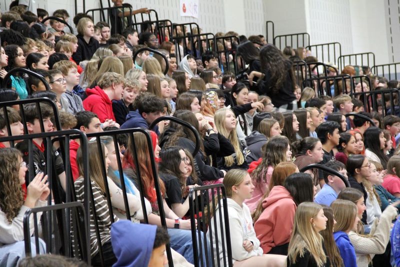 Students cheer on their classmates