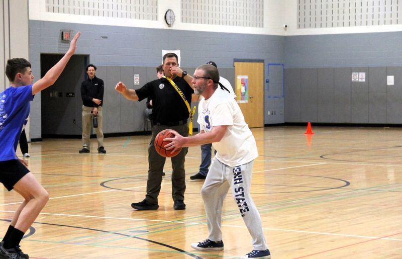 The faculty team is making moves towards the basket