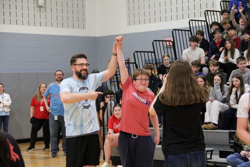 Assistant Principal, Mr. Smith congratulates the hero of the game