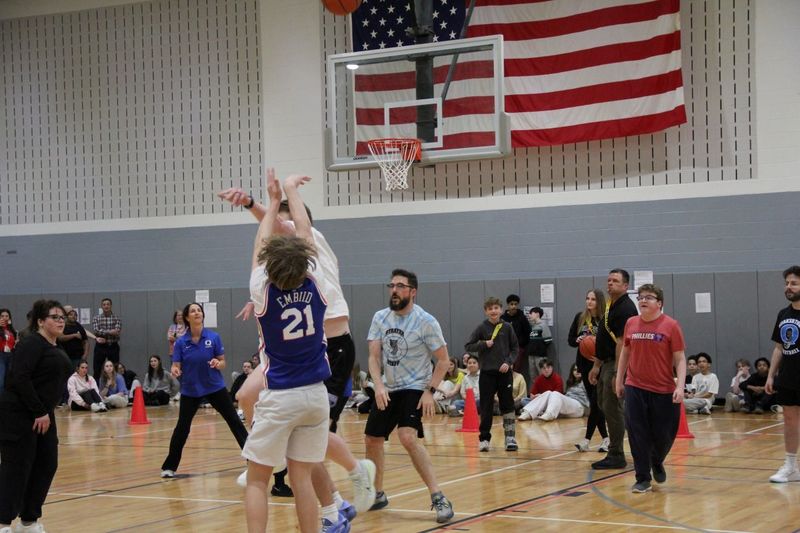 Students make a three point shot!