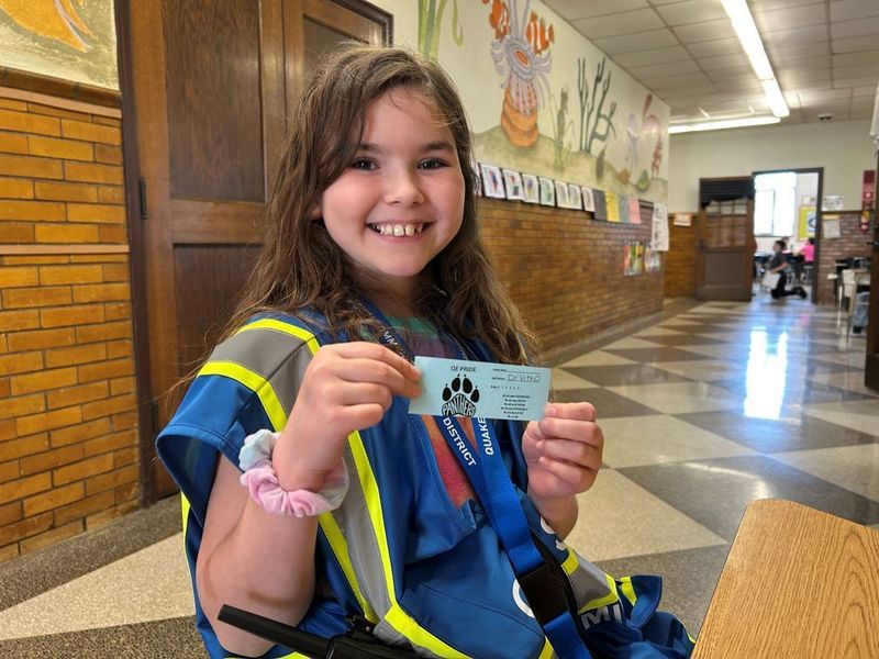 Grace proudly shows her special "Dr. Vitko" PRIDE Tickets