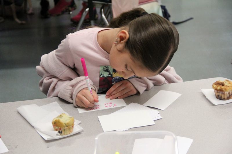 Students writing inspiring cards for their classmates to read during PSSA assessments