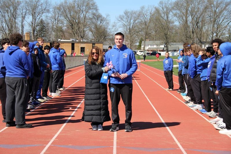 Senior Mac Mitchell celebrated at Boys Track and Field Senior Night.
