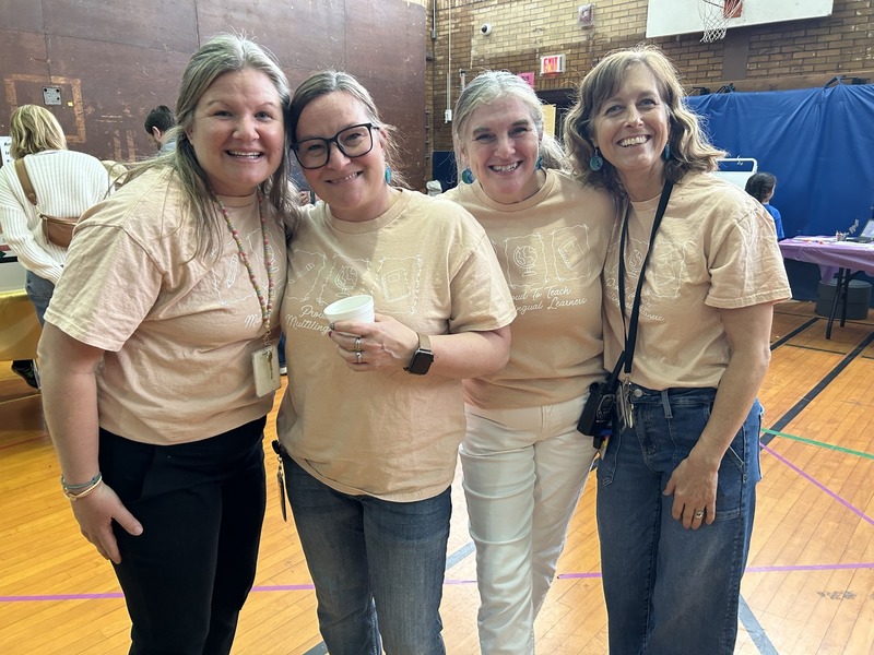 Teachers pose for a photo