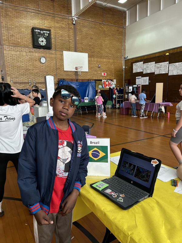 Students pose with their Cultures Day presentation
