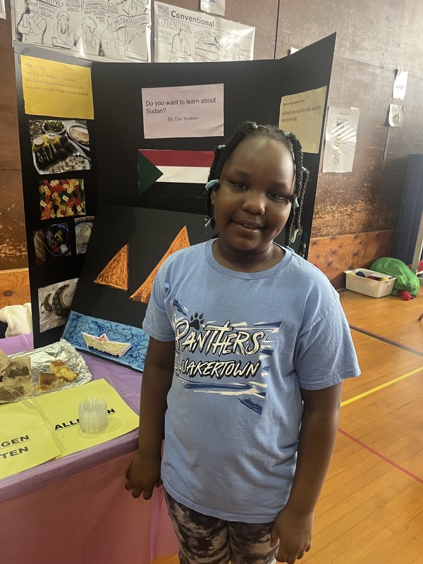 Students pose with their Cultures Day presentation