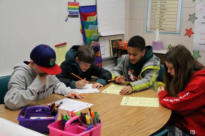 Students brainstorm how they can help their fellow classmates