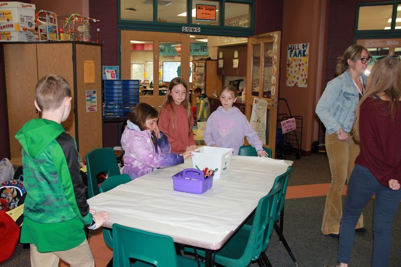 Students create posters to encourage their classmates