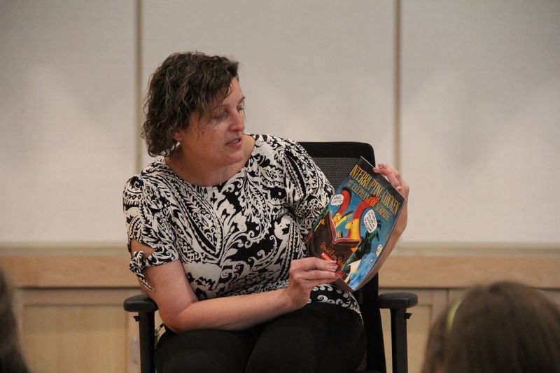 Dr. Hoffman reading to families at Neidig Family Fun night