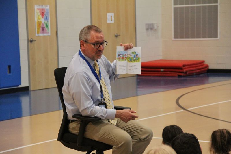 Mr. Godshalk reads to families at Neidig Family Fun Night