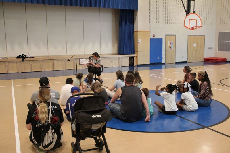 Dr. Hoffman reads to families at Neidig Family Night