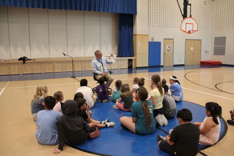 Mr. Godshalk reads to families at Neidig Family Night