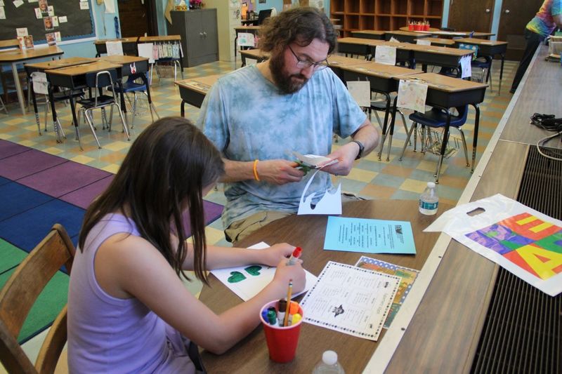 Families participating in arts and crafts