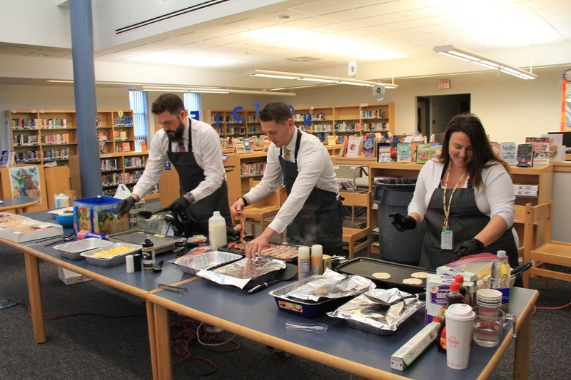 Principal Dr. Crater and Assistant Principals Mr. Smith and Ms. Maddon serve up breakfast for teacher appreciation week