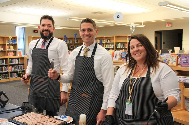 Principal Dr. Crater and Assistant Principals Mr. Smith and Ms. Maddon serve up breakfast for teacher appreciation week.