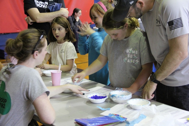 Students making bracelets