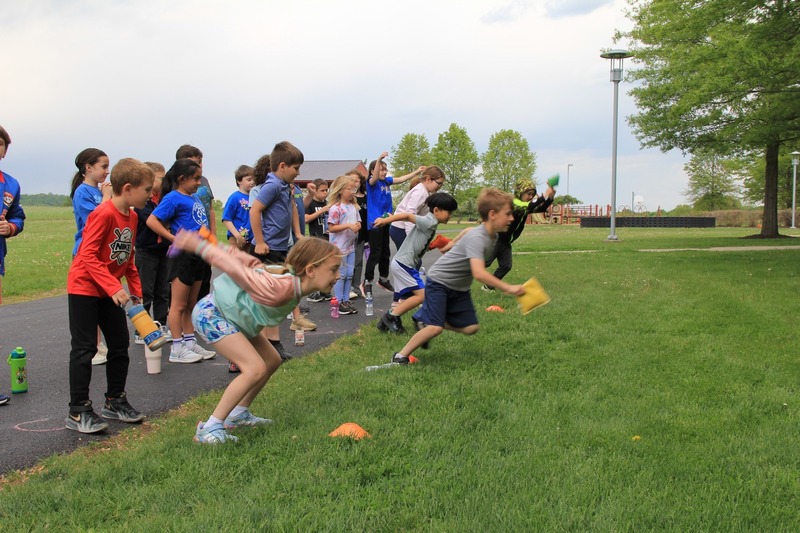 Students participate in the long jump