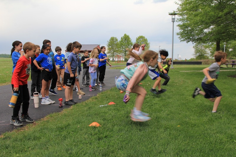 Students participate in the long jump