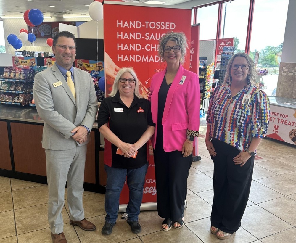 MUMS Administrators accepting a donation from Casey's convenience store