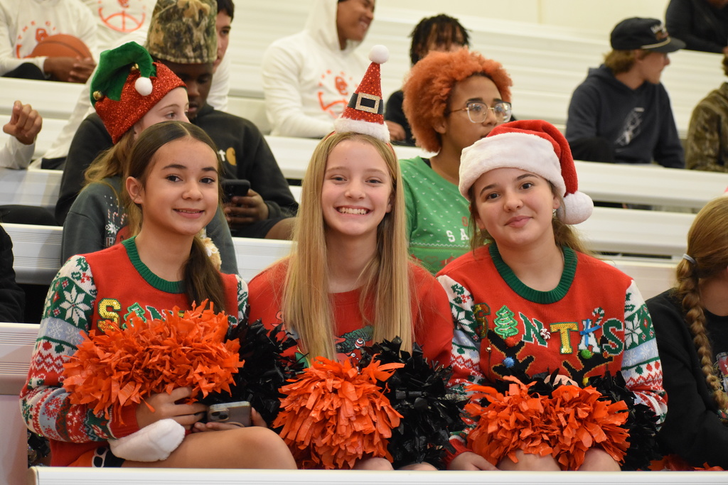 Cheerleaders dressed in their Christmas best ready for Santa Slam
