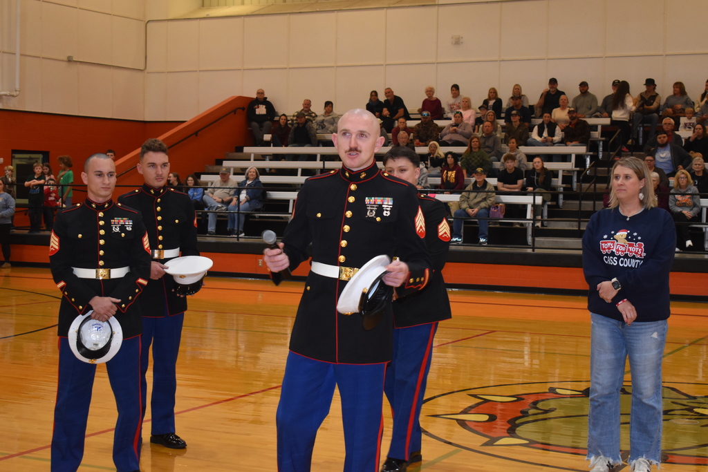 Marines speakingat Santa Slam about the history and importance of Santa Slam