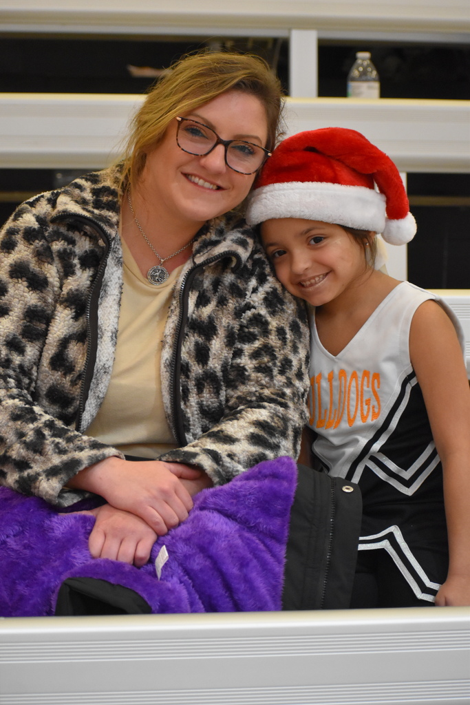 Little Bulldog Cheerleader pictured with mom ready for Santa Slam