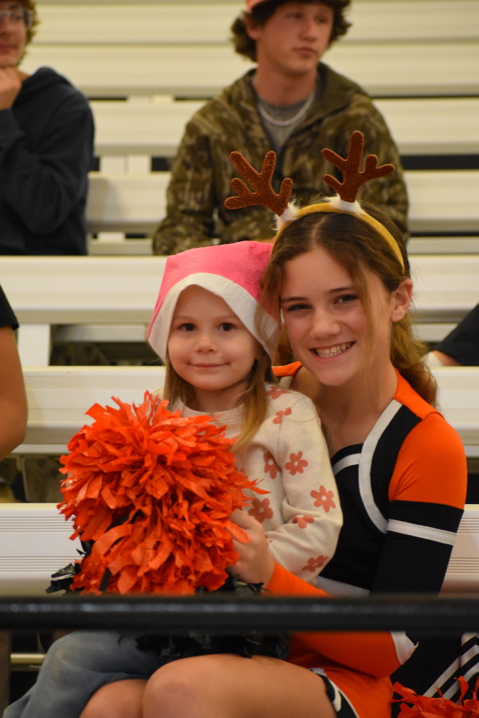 Bulldog cheerleader with a Little Bulldog ready for Santa Slam