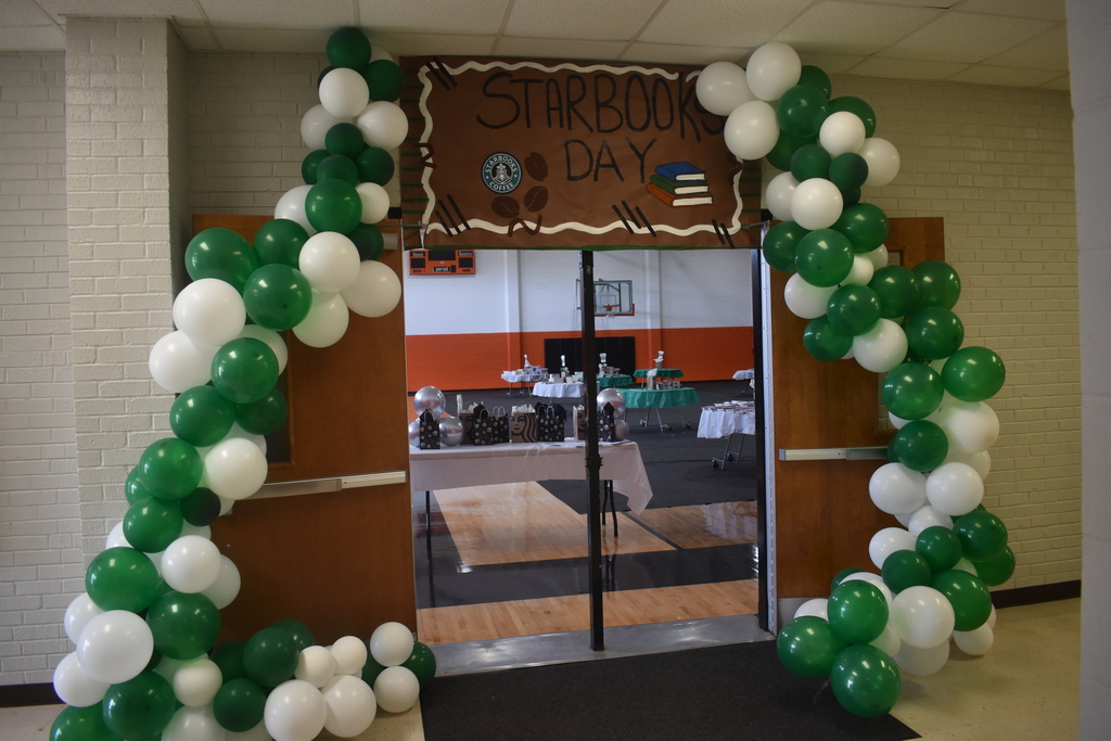starbooks day balloon arch and entrance decorations