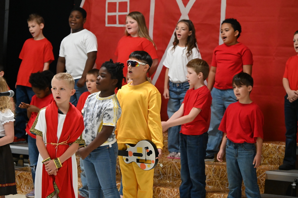 2nd grade students at JKH presenting The Cheese Stands Alone.